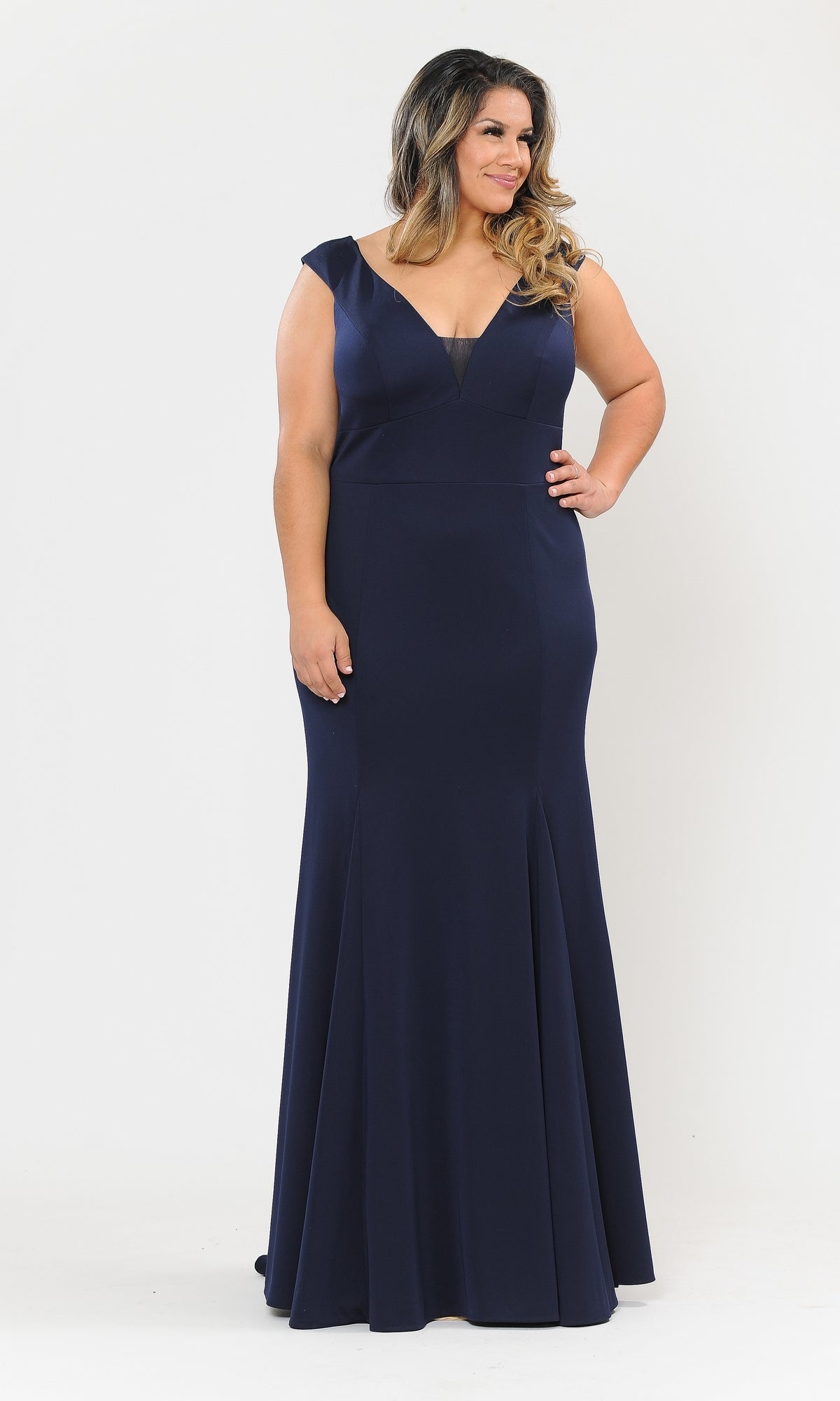 A woman models the Classic Sleeveless Plus-Size Long Prom Dress W1022, a navy blue V-neck floor-length evening gown, against a plain white background.